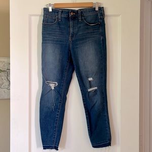 Madewell skinny jeans. Has distressed knee and pant trim detailing.